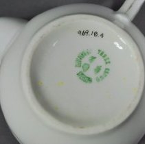 Maker's stamp on underside, detail