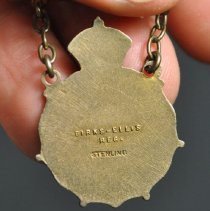 Back with detail of stamped text