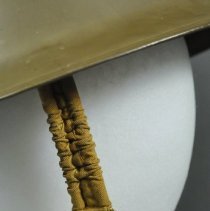 Detail of proper right chin strap