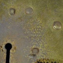 Detail of maker's stamp on lockplate