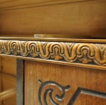Engraved details on front of sideboard (a)