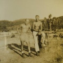John Wylewski and a man standing on a stump