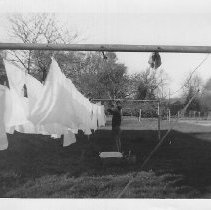 Man hanging sheets