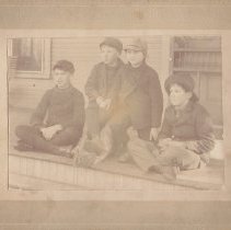 Four boys on a porch