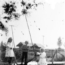 Boy and two girls on a small bridge