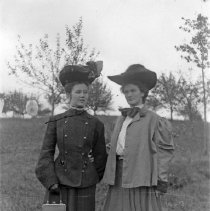 Portrait of two women wearing large hats