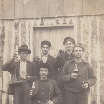 Loggers Relaxing with Beer