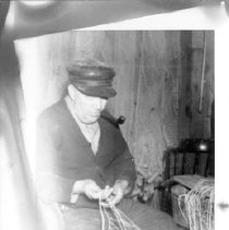 Man Tending to Fishing Nets