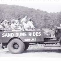 Truck bed style dunesmobile "Sahara Safari" carrying several people