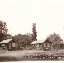 Glimpse of Little Glen's Log Cabin Village - Glen Lake