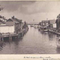 Etta, Bonnie Lass, Helen S and other boats in the Leland River in Fishtown