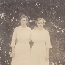 Women in long white dresses