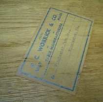 Furniture label affixed to underside of the table