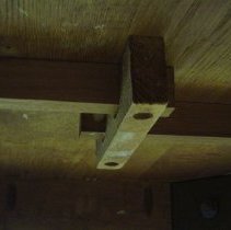 Leaf supports beneath table