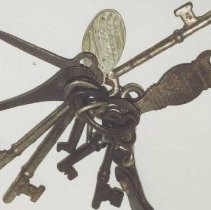 Key ring with keys, bottle opener and ID tag