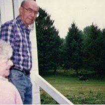 Fred and Mary White with moose in background /