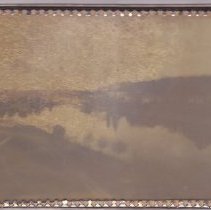 Glass framed view across mill pond