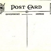 Postcard Main Street northeast of Town Hall - back