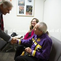 Whit Fraser shaking hands with Oren Lyons