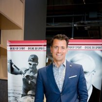 Adam van Koeverden posing for photo.