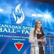 Inductee Susan Auch giving acceptance speech onstage