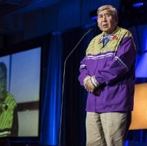 Elder Andrew Wesley speaking onstage at the 2017 ceremony