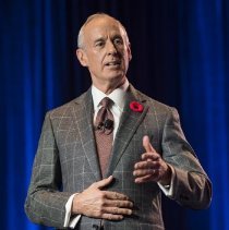 MC Ron MacLean speaking onstage at 2017 induction ceremony