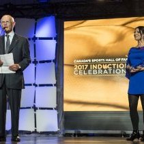 Inductee Dr. Charles Tator acceptance speech, MC Tara Slone in background