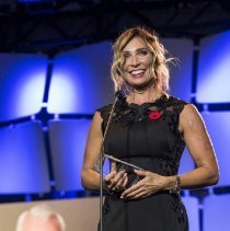 Johannah Jackson speaking onstage during induction ceremony