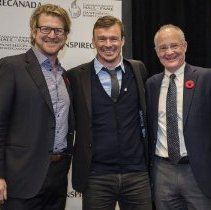 HoF Curt Harneet, inductee Simon Whitfield, and BoG Chair Bob Rooney pose f