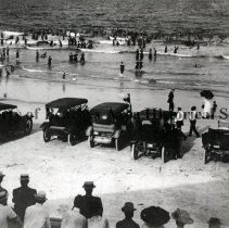 Cars & bathers on the beach