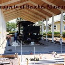 Workers Inside Train Enclosure, 1996