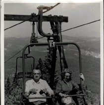Couple Riding the Chair Lift at Terry Peak