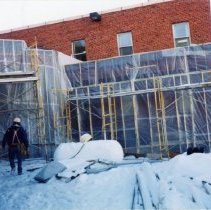 Covered exterior scaffolding during construction