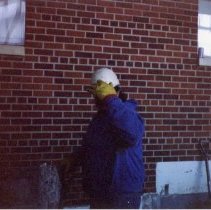 Workman outside hospital building