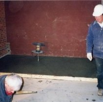 Workmen preparing foundation