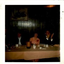 Four individuals seated at an event