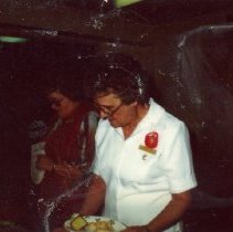 Unidentified woman in a food line