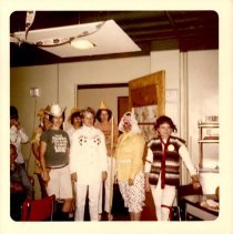Costumed individuals in a cafeteria