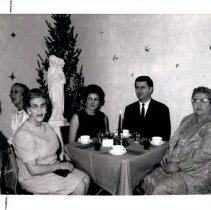 Individuals sitting at a holiday event