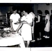 Individuals passing through cafeteria line