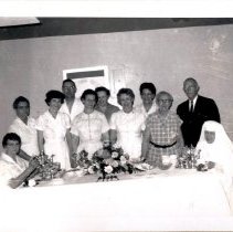 Group photograph at a tea service event