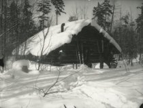 Men at a Cabin in Winter