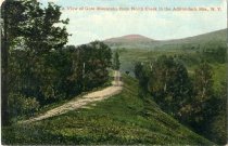 Looking down Main Street, North Cree, N.Y., showing Post Office, Adirondack Mts.