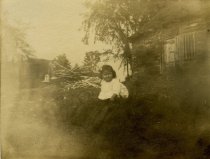 Child Outside a Log Cabin