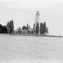 Waterfront view of Point Clark Lighthouse and lighthouse keeper's house.