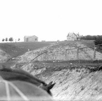 View of the Kincardine countryside with house and barn in background.