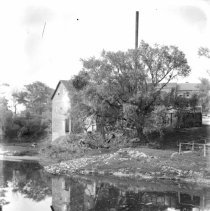 A picturesque view of a mill along a river in the Kincardine area.