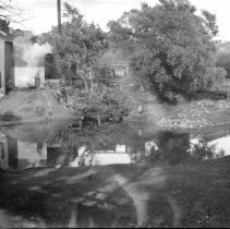 View of a river, mill and buildings, most likely in the Kincardine area.