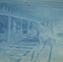 Three men working in Tannery